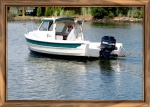 That's me in Jefferson Creek off the lagoons where I am moored. Headed out to Little Assawomen Bay and eventually where I met another 16' C-Dory.
A good friend took this with her new lens and she framed it to perfection.