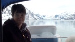 Jo-Lee in front of John Hopkins Glacier with ice chest stuffed with burgy bits.