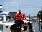 (Aiviq) Wife and kids on the sun deck.  New bombard dingy on pilothouse roof