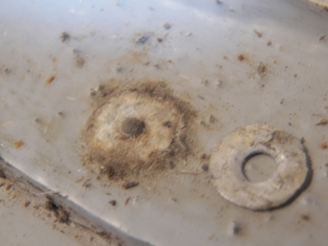 Even the rivets that looked good simply fell apart when bumped or drilled.  These are aluminum rivets with a steel mandrel.  Not a problem if they never get wet.  Oh that's right, it's a boat!
