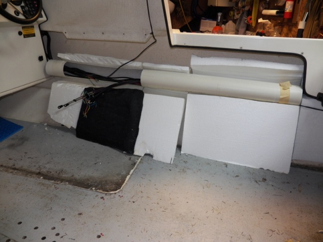 This shows the flotation foam behind the starboard panel.  I intend to reuse most of it, but fastened into place with spray foam.  When loose, they act as wedges against the panels and may have contributed to the pop rivet failures.