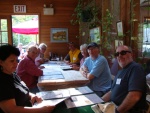 A fuller view of the folks at the table.