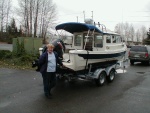 (Joy) Sandra with the Boat when we pulled it out from Lake Washington 1st time out