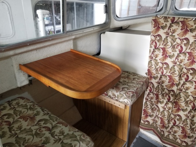 New Table, Custom edging keeps things 'ON' the table, folds flat against the outer wall.