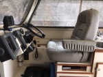 Raised helm seat four inches and added chart storage area