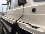 I use a sailboat line lock/cam to secure docking line while underway