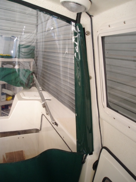 Drop curtain attached inside with velcro.  