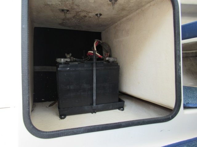 Battery under passenger seat