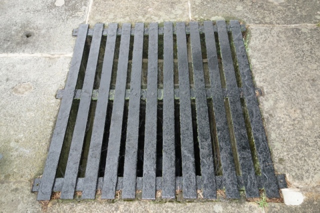 Typical metal sluice vent grate.  In the 1800's a rotund canal Supervisor fell through the wooden grate 13 ft into the rock sluiceway to be spit out into the lock pit amazingly mostly alive.  He mandated steel grates which are still there today, 180 years later.