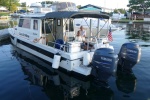 Expedition Mode at Alexandria Bay, St Lawrence Seaway, Bonnie Castle Marina,  NY.  The border with Canada cuts down the middle of the St Lawrence River.  Avoid back and forth stops due to Customs hassle