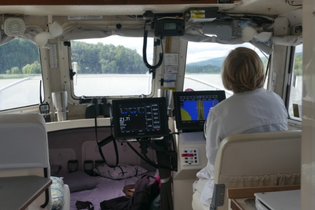 Taking turns in the helm and nav seat.  VHF transmitting (but not listening) requires a FCC radio telephone op permit for outside US including Canada and Bahamas.