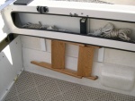 (CAVU) Steps folded flat and stowed on hooks under the starboard shelf.