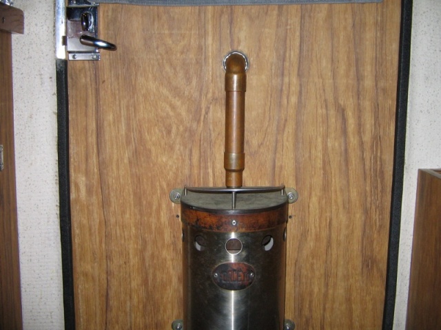 (Nancy H) 
Stack made of copper water pipe and fittings goes thru door.
