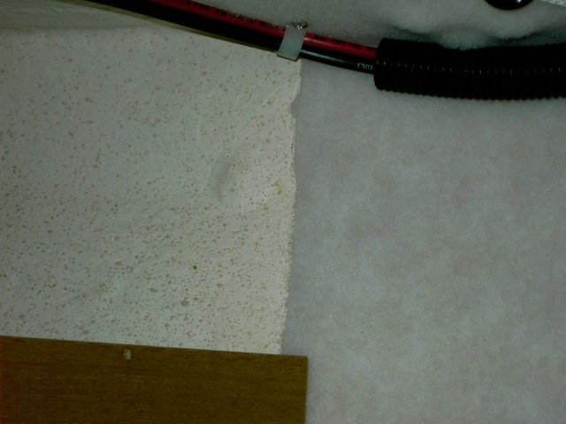 (Lynn Marie) Close-up of hull gelcoat & hulliner carpet. Both have similar white and tan colors.