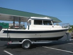 Stopping for gas another shot of Bayliner trailer I've upgraded to tandem axcel alum. trl. with disc brakes