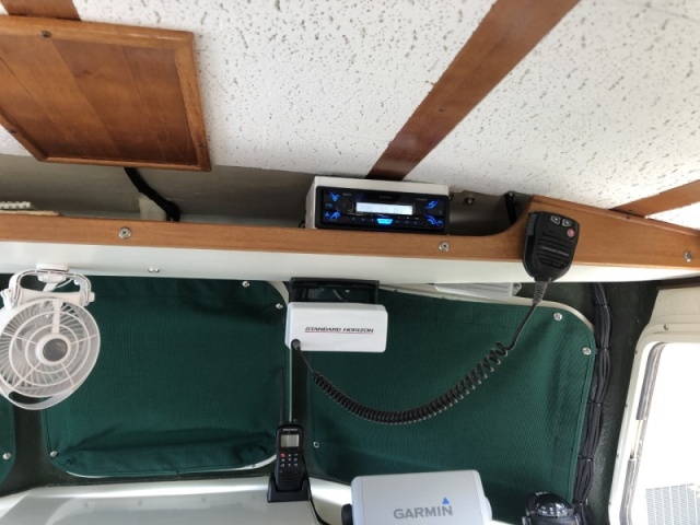 Stereo installed on shelf above helm