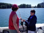 Grandson learning the touch for sturgeon nibbles