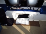 The added middle hatch is great for storage and also allows the bilge to air out nicely while resting at the marina.  The side hatches have battery shelves and don't provide the same level of ventilation