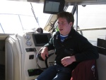 Tim at the helm - Jr's boat