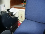GFI mounted in plastic outlet box next to Captain's chair. Each GFI is connected to it's own breaker. Small speaker to the side of GFI is for VHF radio.