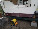 put the boat on blocks supported at the chines to keep the hull from warping
