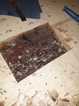this is the area of dark shavings under the galley, it was rotten and there was a void there where they didn't get enough resin to bond the balsa to the bottom skin