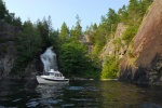 Anchored beneath the waterfall at Teakerne Arm