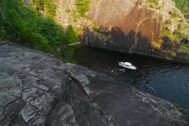 Anchored beneath the waterfall at Teakerne Arm