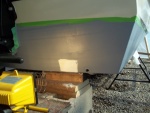 4/24/11..used Marine-Tex to fill screw holes/heat lamp to help in curing/applied 1st coat of ( Grey ) InterProtect 2000E