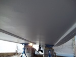 4/25/2011..2nd coat of Interprotect (white) applied...who says wax paper doesn't stick/i had to sand out the wax paper from my hull.Love those boat jack stands,makes life alot easier.I will buy two more.