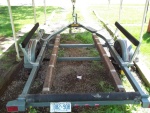 July 11/2011..another view of my EZ-Loader trailer...notice the Duct Tape on the carpeted bunks, never go anywhere without it.