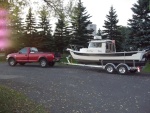 04/10/2010 Pulled my boat for the season while the weather is warm enough to do some bottom painting. Tomorrow i will put the front trailer jack on a bathroom scale to check the tounge weight.I think the axiles need to be moved forward about six inches.There seems to be more weight on the forward tires.