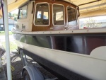 08/10/2011..used 3M Marine Rubbing Compound than Collinite's No. 925 Fiberglass Boat Wax on the Black trim...by hand.I got a shine but there are still streaks embedded into the 1985 gel-coat