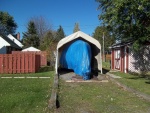 21/10/2011..all bundled up for the winter.. its to cold outside to measure for a custom storage cover this year,will have to wait untill the Spring..i reinforced the garages' tie downs, i hope the wind doesn't blow the shelter down, if it get too windy i will have to take the side and rear panels off.