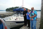 Reverend Jim christens Caiprianha with Paul & Amy