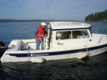 Fred (ANITA MARIE) at the 
helm & Joe (R-MATEY) on
 deck of the Venture 23.