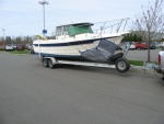 Waiting for 1st mate at Burlington, Wa. mall. 
Windshield and hull covered.
Heading to Alaska