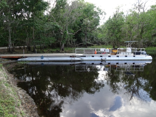 A year of construction, after severe flooding, represented by the work barge, which people, material and vehicles are brought to the Island to repair the damage. 