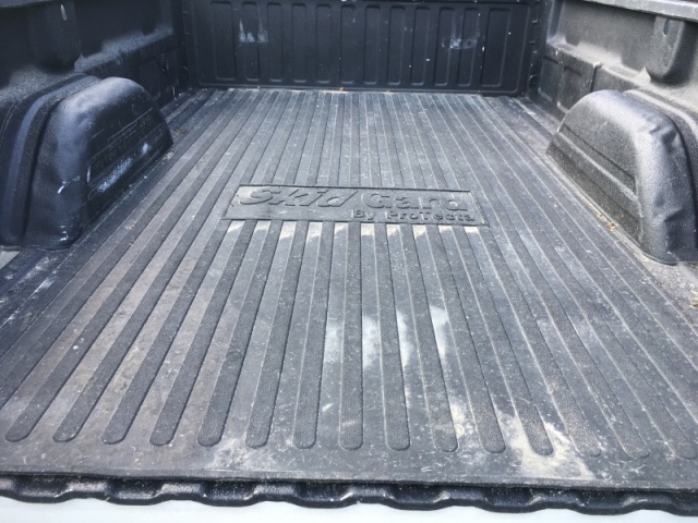 Mat between truckcamper & truck bed for bed & camper protection & to keep camper from moving in bed with normal tie downs