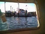 Brant Point CG Station and 47 foot patrol boat guarding INN THE WATER