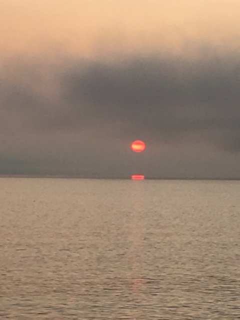 Sun peeking through the smoke, 05:00 7-7-19 Kachemak Bay AK.