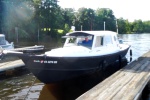 Bruce on RIVER HORSE moored at River's Rest [osprey]