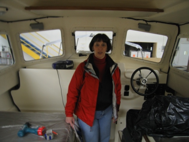 Dee checking out the inside of the almost done 25' C Dory. Is it really ours? 4/16/05