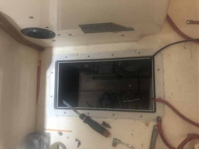 Built platform with trex. Screwed battery boxes down, accessible from this hatch or from the hatch under the sink. 