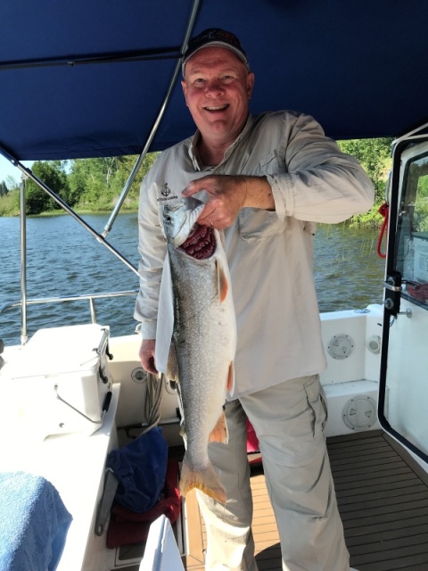 Midnight Flyer\'s Colby pretty happy with his catch of Lake Trout