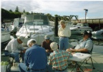 (R/J): Mussel cleaning time. Lane (SunFish), Cap't Mac (Two Lucky Fish), Evelyn (Brave Heart), Roger (Sensei). Their backs to the camera: Joe (R-Matey) & Bill (Brave Heart).