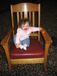 Lili waiting for her Suzuki motor to be fixed.  By the time its fixed she might fit into this chair.