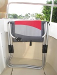 GCI Outdoor, Highlander Chair Folded. Black velcro strap holds chair closed.