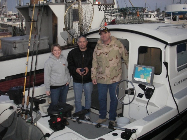 Cockpit of Long Story with daughter and Wounded Warriors opening day at Westport. Picture shows our style of boat with rear helm. 