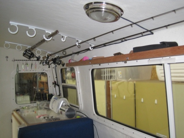 Port view, home made shelf above window, rod holder, top of storage locker